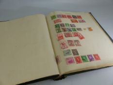 Stamp album containing stamps from around the world and a small selection of First Day covers.