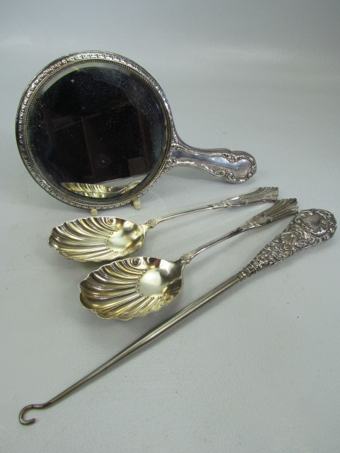 Hallmarked silver mirror, similar button pull and two spoons.
