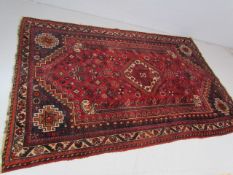 Red ground woollen carpet