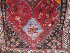 Small middle eastern red ground carpet 70cm x 42cm