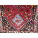 Small middle eastern red ground carpet 70cm x 42cm