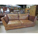 Tan leather knoll drop arm three seater sofa labelled HALO