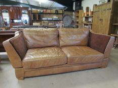 Tan leather knoll drop arm three seater sofa labelled HALO
