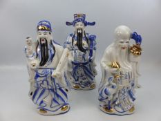 Three oriental china figures depicting the Deities