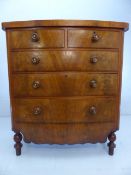 Antique mahogany chest of four drawers with large shaped bottom. Tiger Stripe type wooden handles