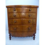 Antique mahogany chest of four drawers with large shaped bottom. Tiger Stripe type wooden handles