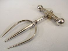 Unusual silverplated fork with mother of pearl handle and decorated ball finials