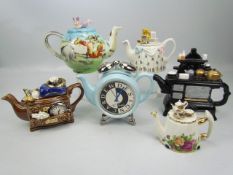 Ornamental collector teapot to include four Cardew Teapots, Royal Albert Country roses and one