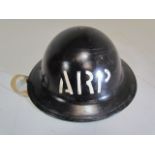 Military interest: one tin helmet black and marked "ARP" with original lining