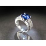 18ct (750) White Gold diamond and blue stone ring. Centre round blue stone measures approx 8.5mm