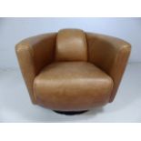 Mid century style tan leather and chrome based armchair.