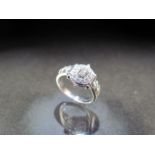 18CT white gold diamond halo style dress ring of approx 60pts