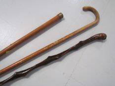 Three vintage walking sticks