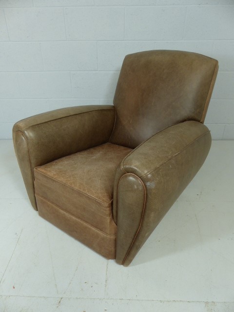 Low tan leather club chair