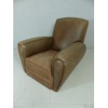 Low tan leather club chair
