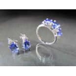 14K White Gold Tanzanite three stone ring and a matching pair of earrings. Ring - 3 Round cut