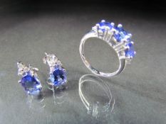 14K White Gold Tanzanite three stone ring and a matching pair of earrings. Ring - 3 Round cut