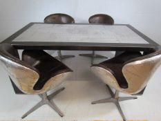 Modernist Industrial table with steel plated top and matching chairs. By 'The One'