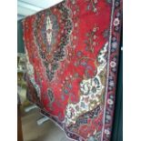 Red Ground persian tabriz carpet with floral medallion design.