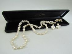 Fresh water single string of pearls approx 24' long with an approx 7.8mm 14k gold clasp. plus two