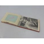 Autograph book containing signed autographs by: Peter Bonetti; Steve Perryman; signed photo James