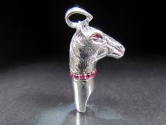 Silver (sterling) whistle in the form of a horse set with a ruby collar