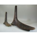 Two Victorian cast iron shoe lasts