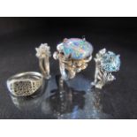 Three hallmarked silver rings and one other set with opal doublet