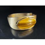 Contemporary 9ct Gold Satin finished bangle approx 24.6mm narrowing to 12.3mm at the back. Set