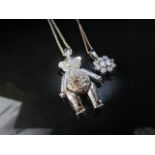 Two boxed pendants on chains to include Paste Set Articulated Teddy Bear and hung from 31" trace