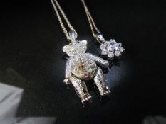 Two boxed pendants on chains to include Paste Set Articulated Teddy Bear and hung from 31" trace