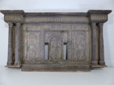 Antique heavily carved wall piece with pillared sides