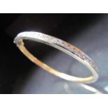 14K bangle set with 24 diamonds approx .05ct. Weight approx 18.8g.
