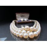 Cased set of pearl earrings and a graduated pearl necklace