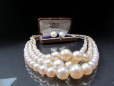 Cased set of pearl earrings and a graduated pearl necklace