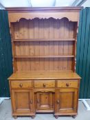 French Pine dresser with shelves over and cupboards under.