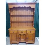 French Pine dresser with shelves over and cupboards under.