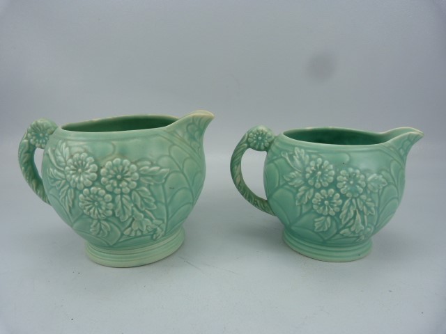 Arthur Woods Mid century pair of graduating turquoise glazed jugs