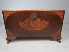 Carved camphor wood chest by Wahidah Furnishings.