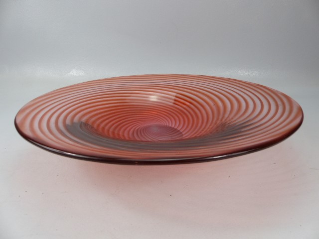 Art glass charger decorated with red swirls through clear glass. - Image 2 of 2