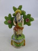 Staffordshire early 19th century figure titled 'Gardners' of a lady surrounded by Bocage. The