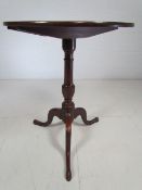 Georgian mahogany tip up table on tripod feet