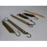 Small collection of Spring balance scales and a Gold plated propeller paper knife