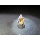 1920's Silver and marcasite pendant set with an oval cur Citrine