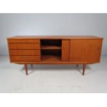 Teak Mid Century sideboard with 4 drawers to side and sliding cupboard.