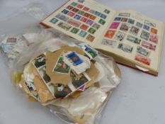 Selection of loose stamps and a stamp album