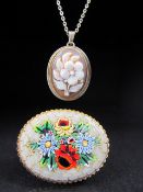 Cameo of a Flower approx 29.5mm x 18.8mm and hung from an 835 silver trace link chain . Together