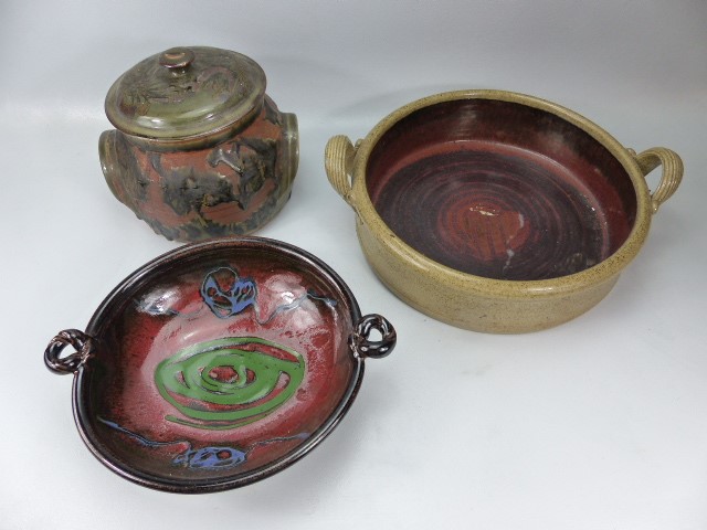 Three pieces of Studio pottery to include a lidded pot, twin handled bowl and one other