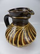 Studio Pottery large oversized jug decorated in enamelled earthenware colours.
