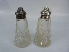 Two hallmarked silver topped salt shakers